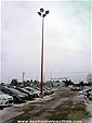 Picture: Approx 12  40 ft Steel Commercial Light Poles and Industrial Lighting for Sales Lot. Note:  Some have already been taken down.  